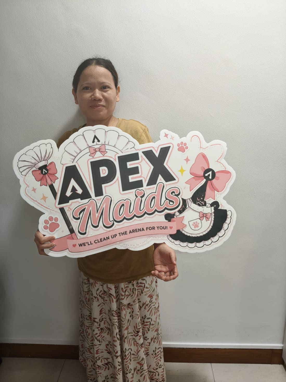 Apex Maids helper with agency placard